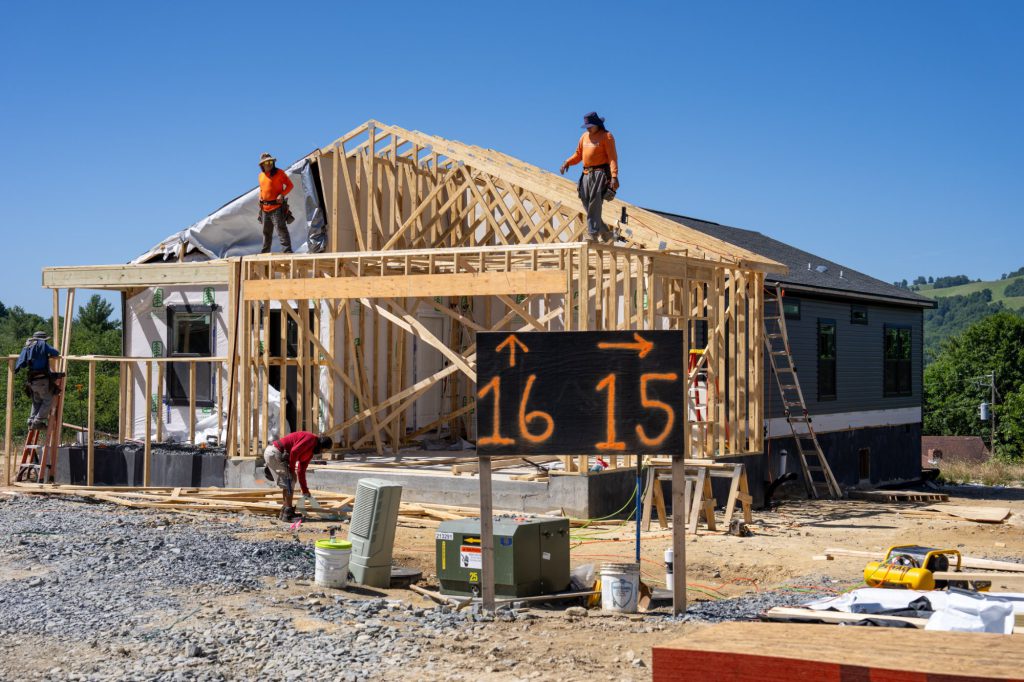 Crews framing a Blue Haven home