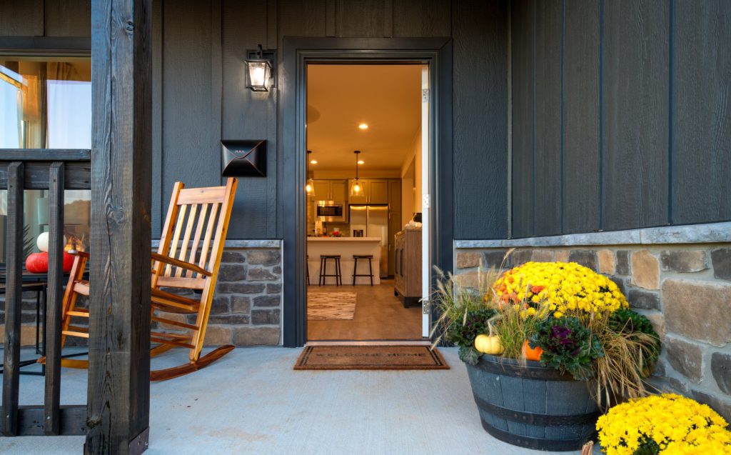 Front porch of a finished Blue Haven Avery home, door open to the kitchen