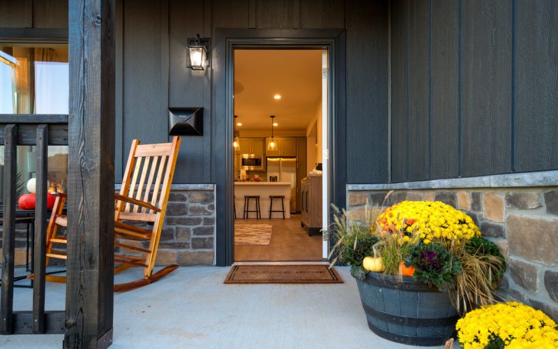 Front porch of a finished Blue Haven Avery home, door open to the kitchen